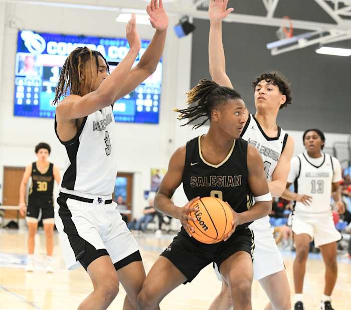 De’Undrae Perteete is surrounded by Millennium players in a tight down-to-the-wire game.